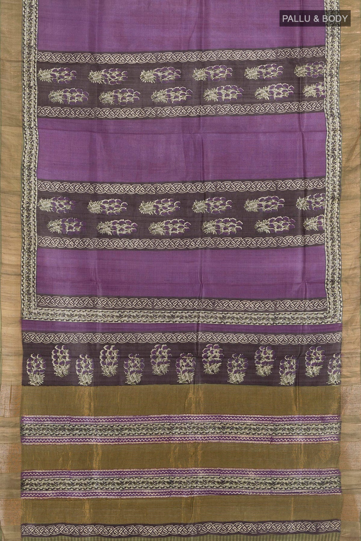 Flat view of Purple Tussar Saree with Printed design on the body and Zari Border. 