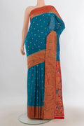 Peacock Blue Blended Paithani Silk Saree with Zari Butta on the body and Paithani Border.  displayed on a mannequin