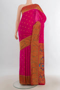 Dark Pink Blended Paithani Silk Saree with Zari Butta on the body and Paithani Border.  displayed on a mannequin