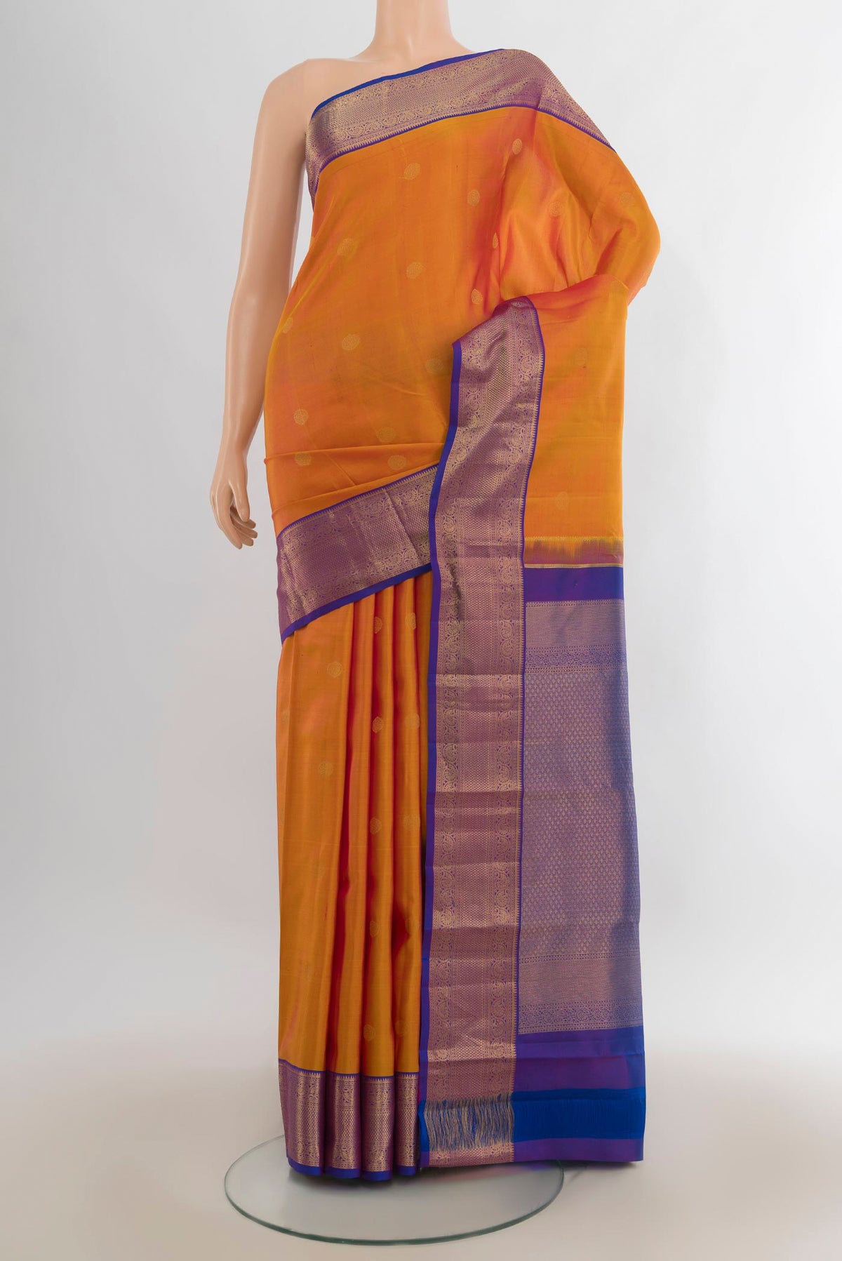 Pure Silk Yellow Kanjivaram Saree with Zari Butta on the body and Zari Border.  displayed on a mannequin