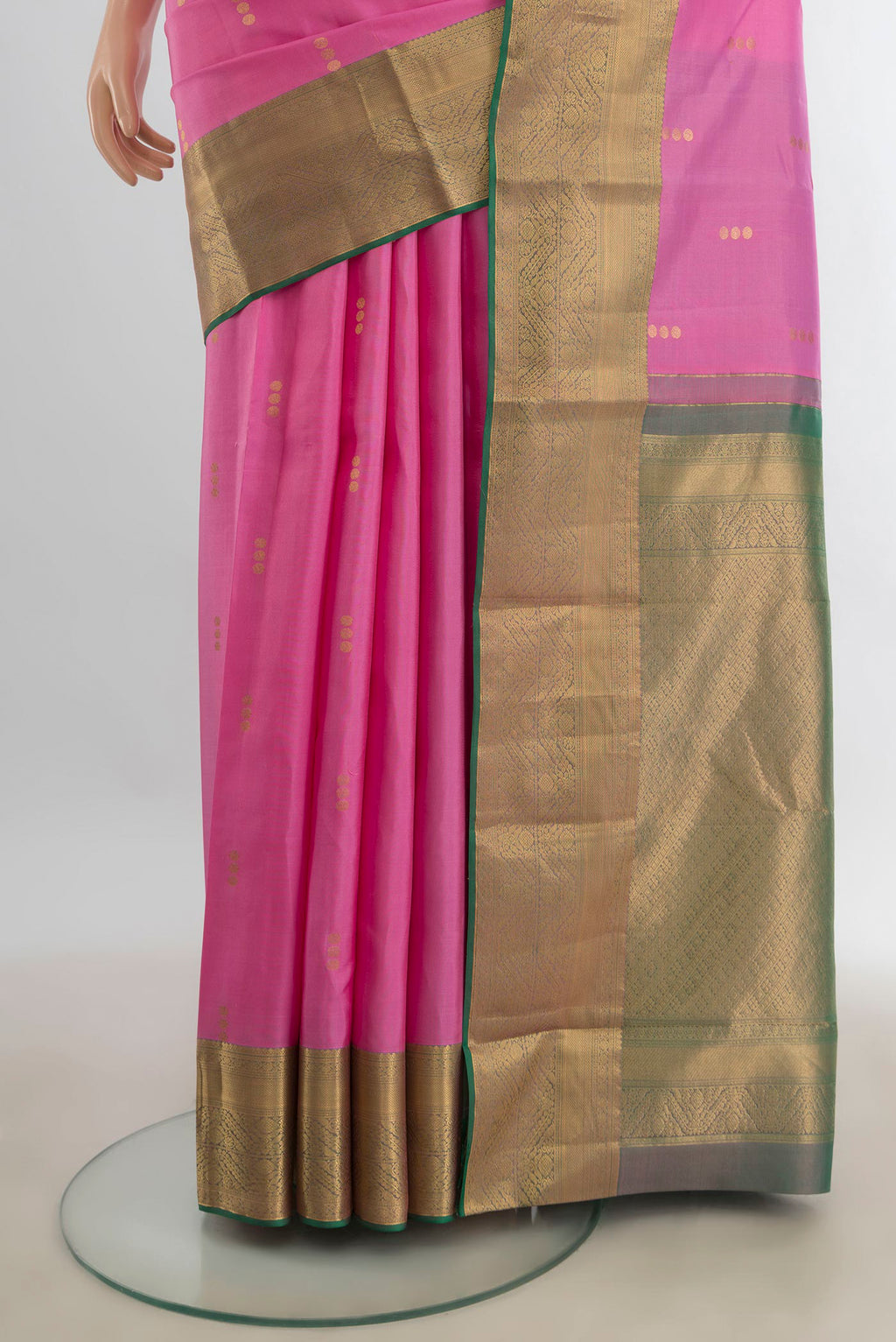 Pleats and pallu of Pure Silk Rose pink Kanjivaram Saree with Zari Butta on the body and Silk Border. 