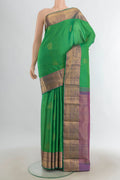 Pure Silk Mint Green Kanjivaram Saree with Zari Butta on the body and Silk Border.  displayed on a mannequin