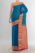 Pure Silk Light Blue Kanjivaram Saree with Zari Butta on the body and Silk Border.  displayed on a mannequin