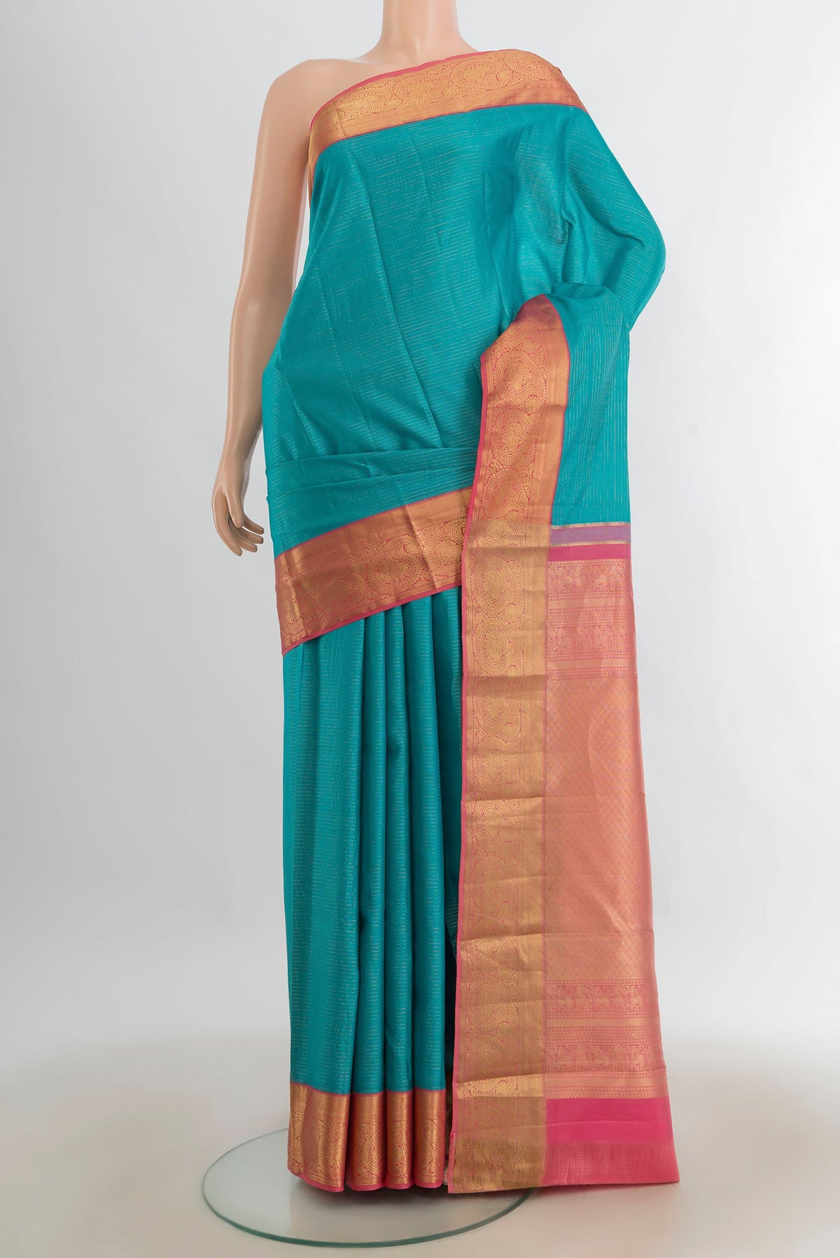 Pure Silk Light Blue Kanjivaram Saree with Zari Butta on the body and Silk Border.  displayed on a mannequin