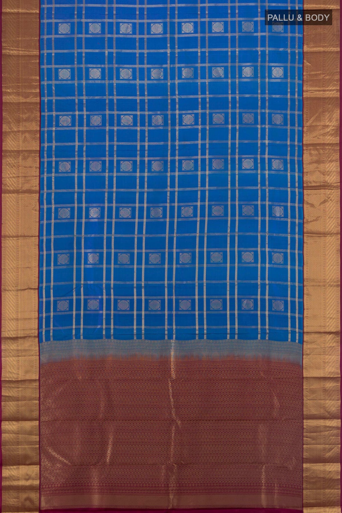 Flat view of Pure Silk Blue Kanchipuram Saree with Checked design on the body and Zari Border. 