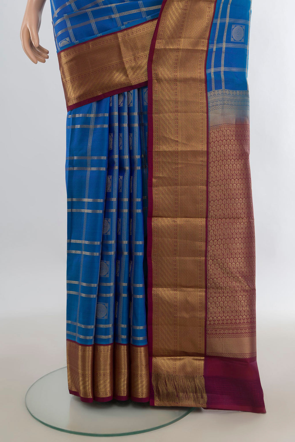 Pleats and pallu of Pure Silk Blue Kanchipuram Saree with Checked design on the body and Zari Border. 