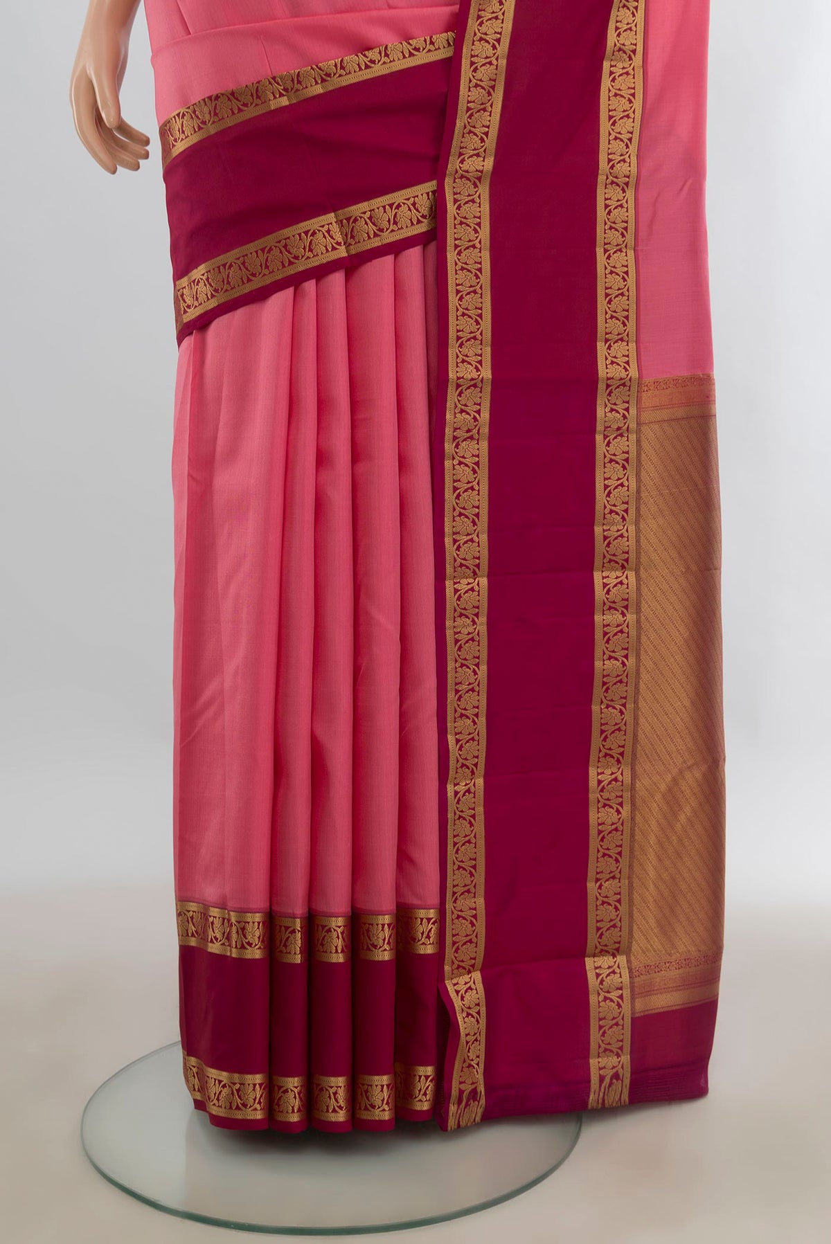 Pleats and pallu of Pure Silk Pink Kanchipuram Saree with Checked design on the body and Zari Border. 