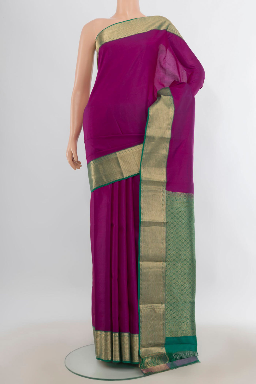 Pure Silk Magenta Kanjivaram Saree with Plain Body and Zari Border.  displayed on a mannequin