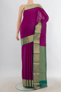 Pure Silk Magenta Kanjivaram Saree with Plain Body and Zari Border.  displayed on a mannequin