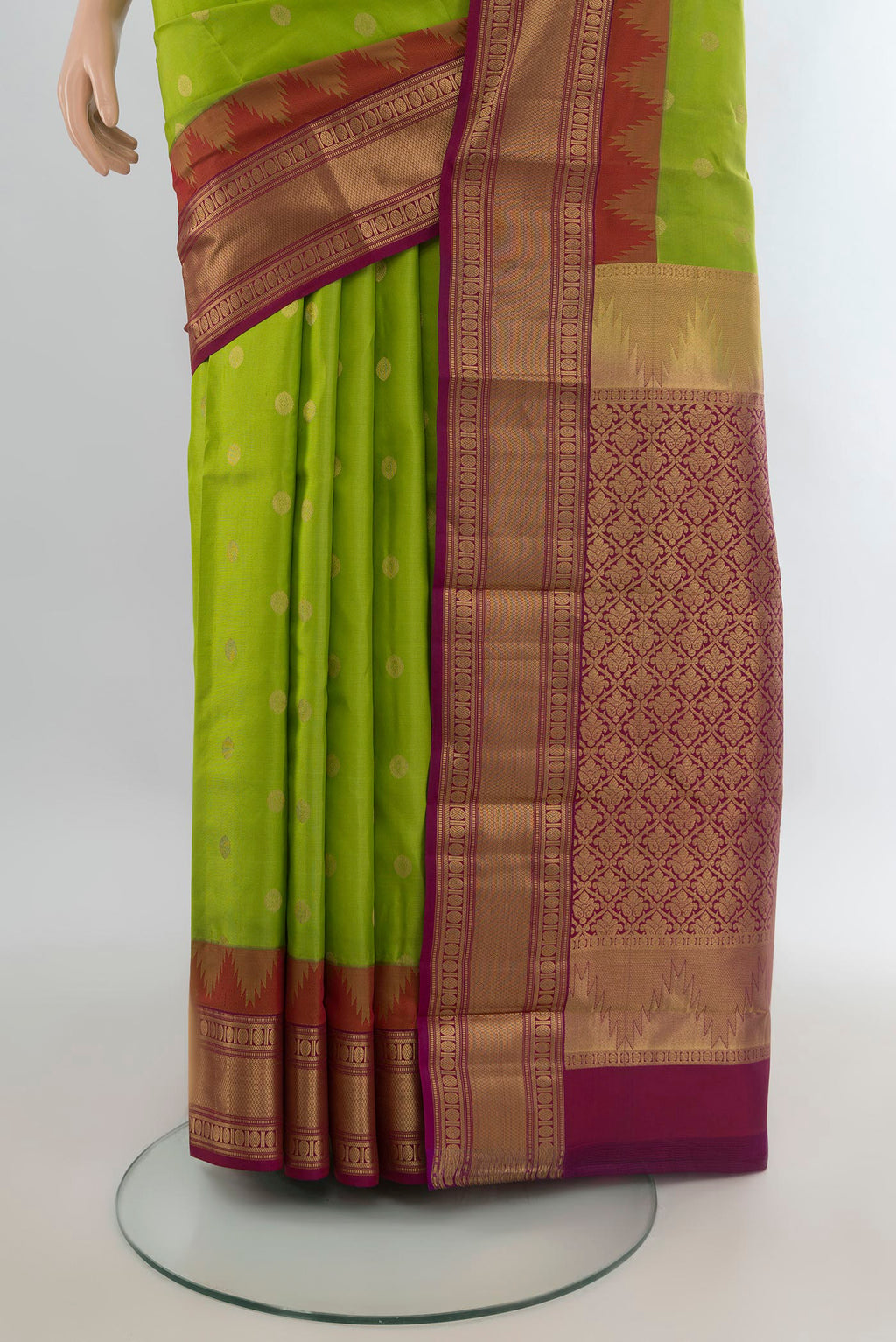 Pleats and pallu of Pure Silk Parrot Green Kanjivaram Saree with Zari Butta on the body and Zari Border. 