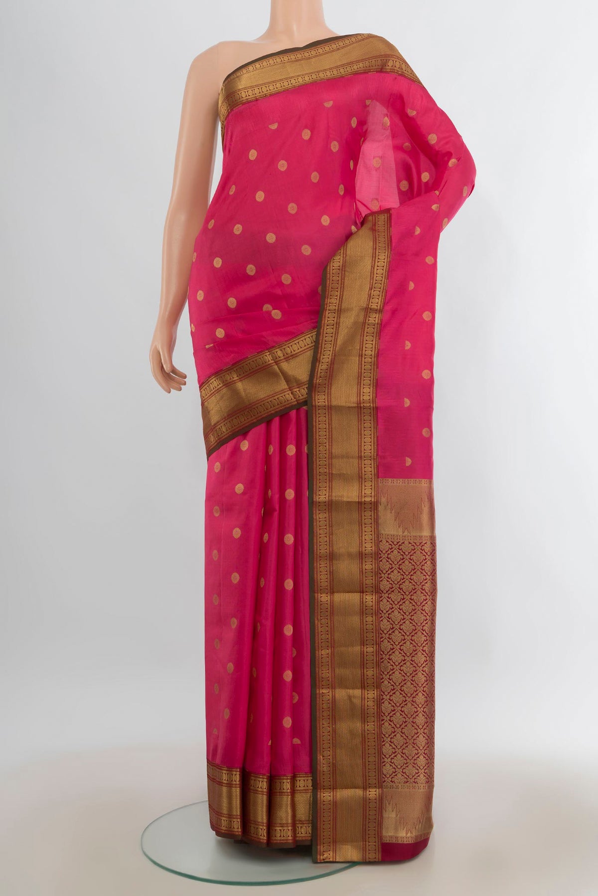 Pure Silk Pink Kanjivaram Saree with Zari Butta on the body and Zari Border.  displayed on a mannequin