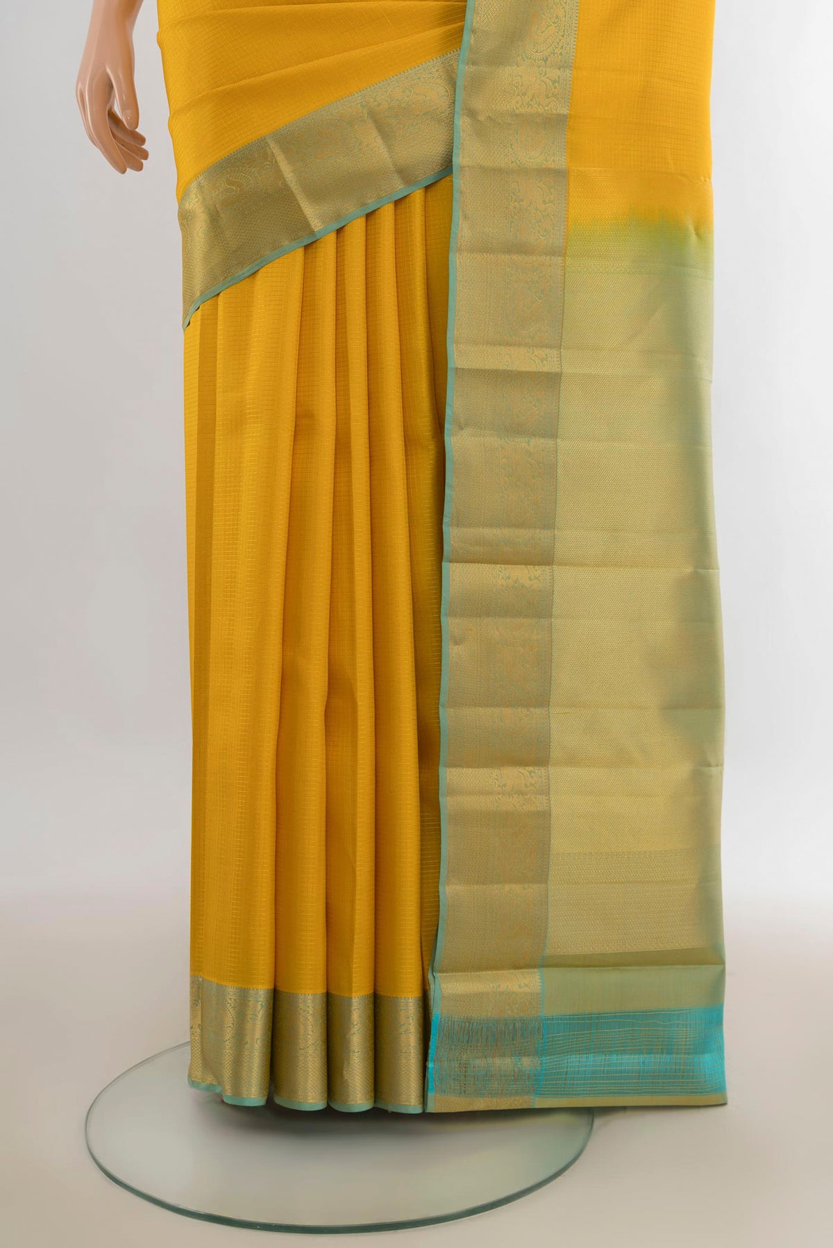 Pleats and pallu of Pure Silk Yellow Kanchipuram Saree with Checked design on the body and Zari Border. 