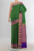 Pure Silk Mint Green Kanchipuram Saree with Zari Butta on the body and Silk Border.  displayed on a mannequin