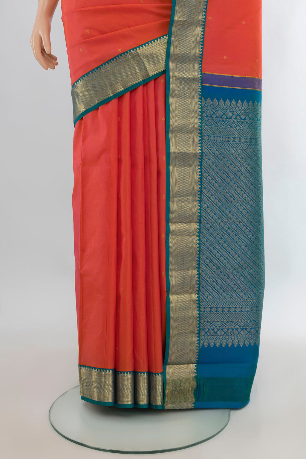 Pleats and pallu of Pure Silk Brick Orange Kanjivaram Saree with Zari Butta on the body and Zari Border. 