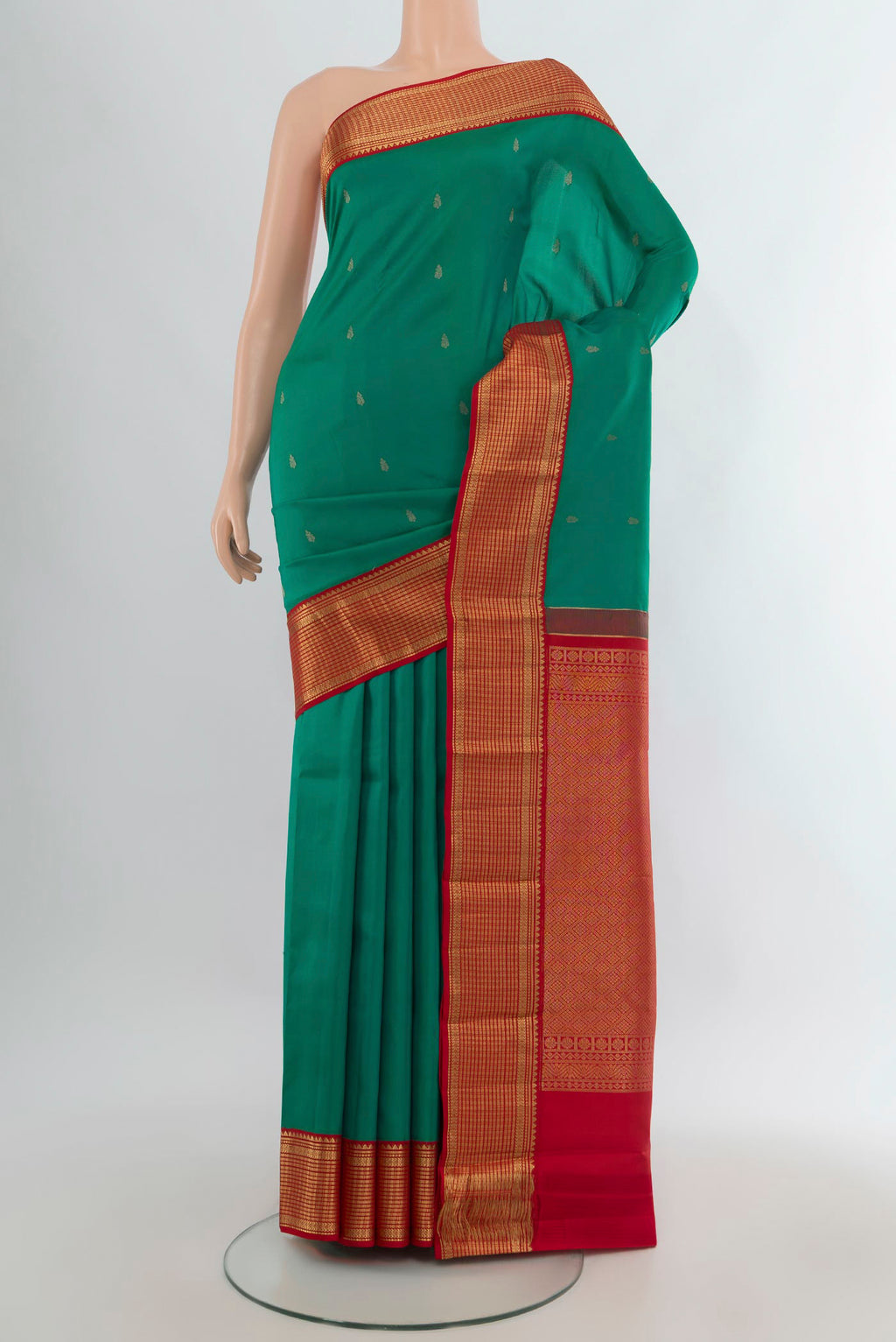 Pure Silk Green Kanchipuram Saree with Zari Butta on the body and Zari Border.  displayed on a mannequin