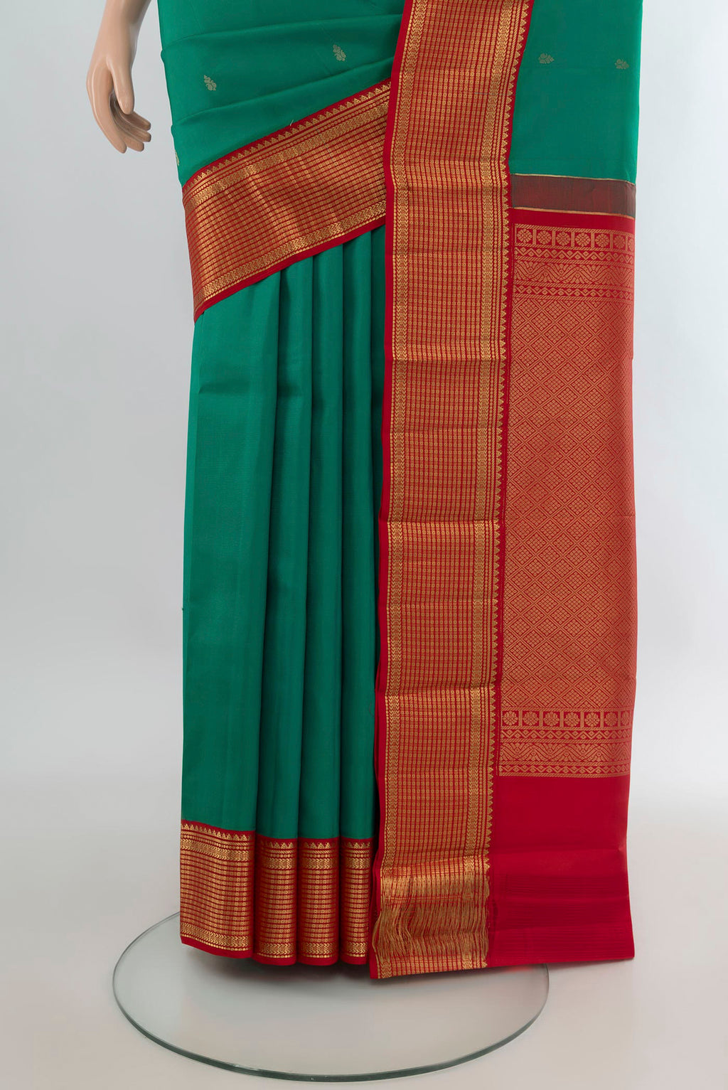 Pleats and pallu of Pure Silk Green Kanchipuram Saree with Zari Butta on the body and Zari Border. 