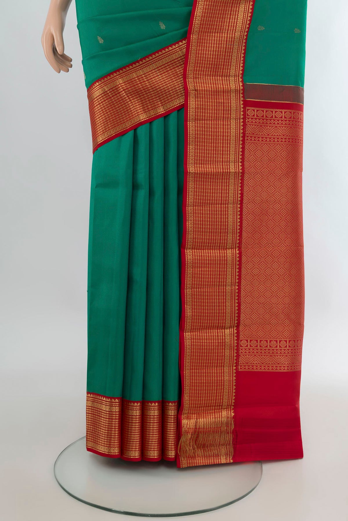 Pleats and pallu of Pure Silk Green Kanchipuram Saree with Zari Butta on the body and Zari Border. 