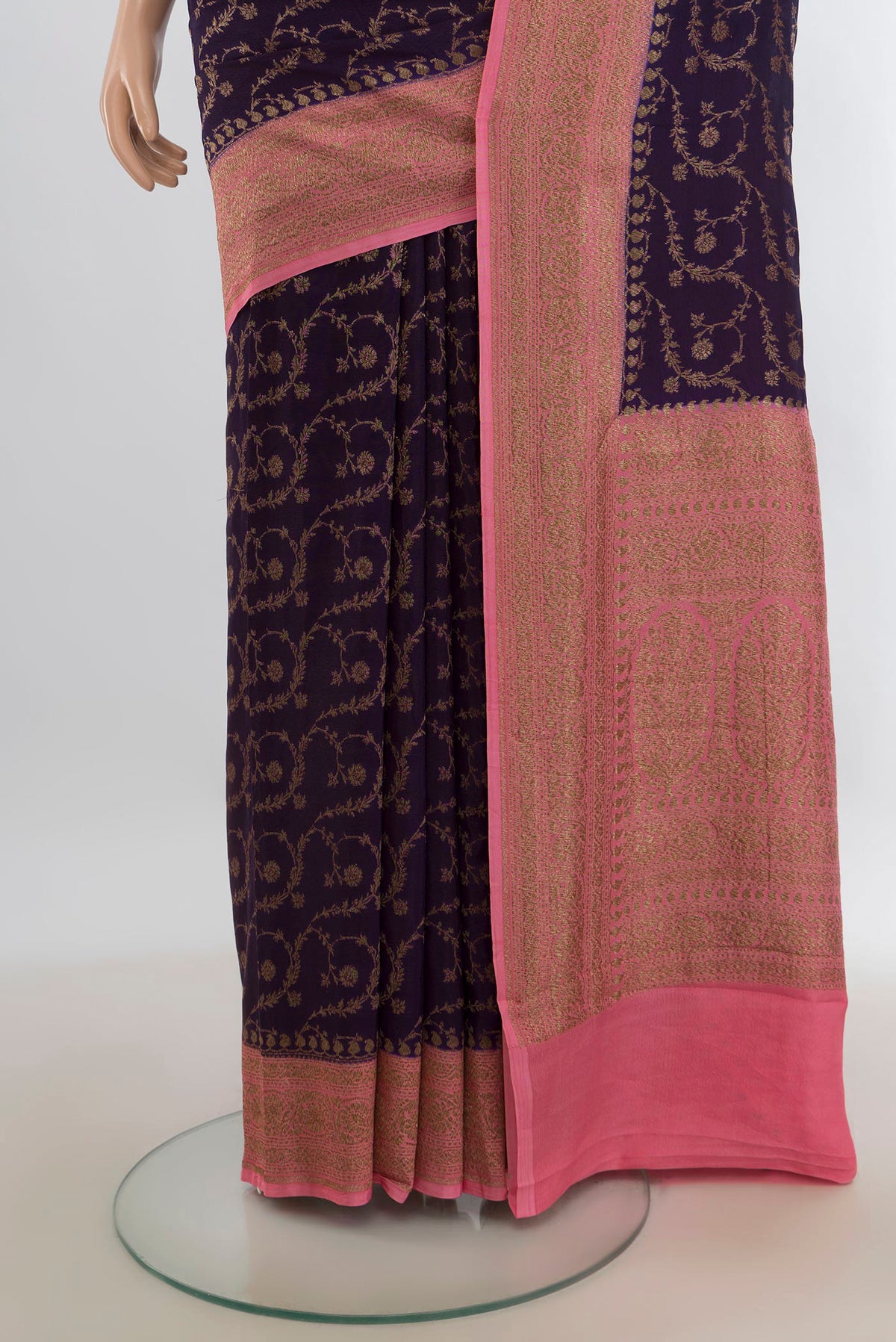 Pleats and pallu of Violet Banarasi Georgette Saree with Zari Butta on the body and Zari Border. 
