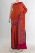 Orange Banarasi Georgette Saree with Zari Brocade on the body and Zari Border.  displayed on a mannequin