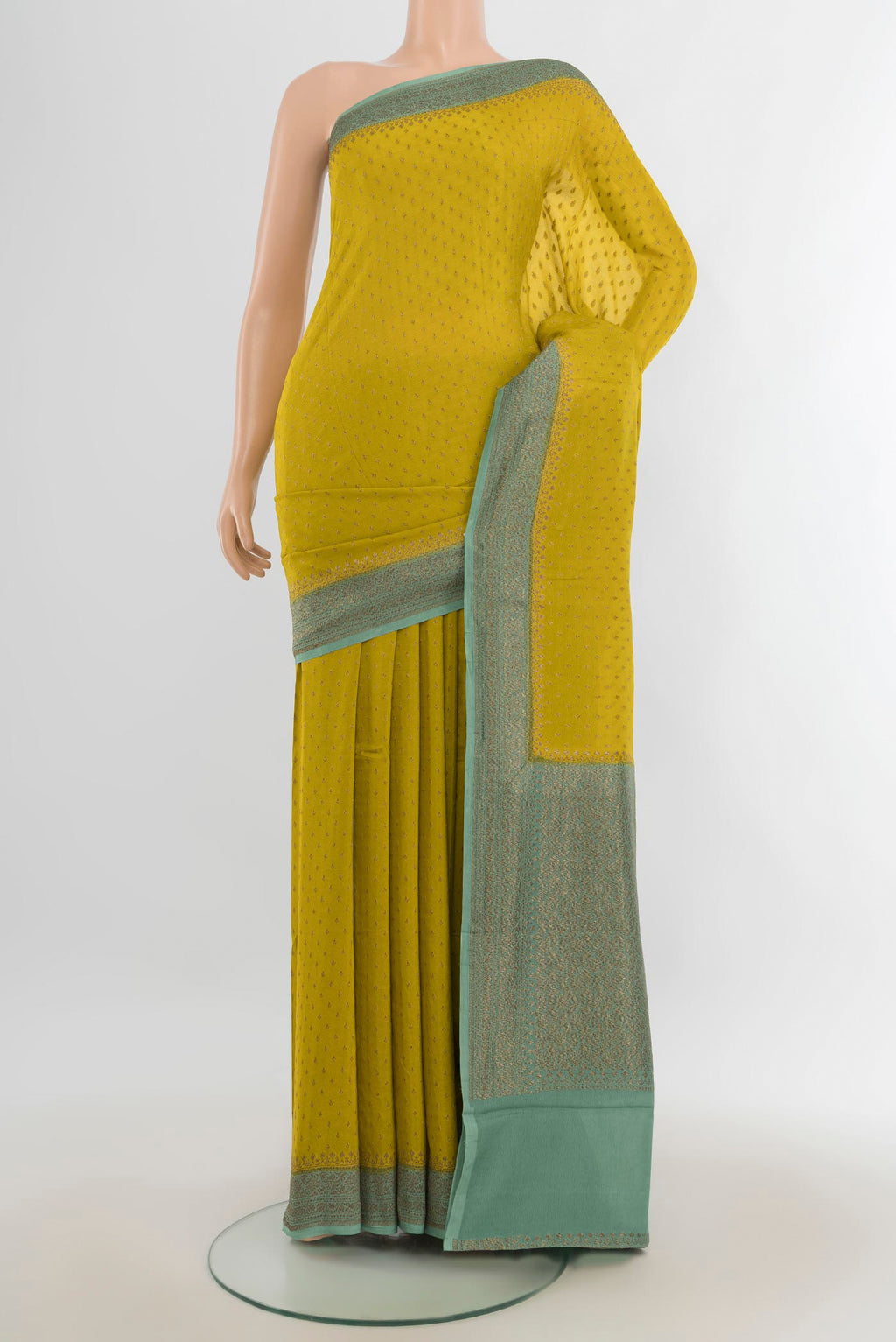 Mehandi Green Banarasi Georgette Saree with Zari Butta on the body and Silk Border.  displayed on a mannequin