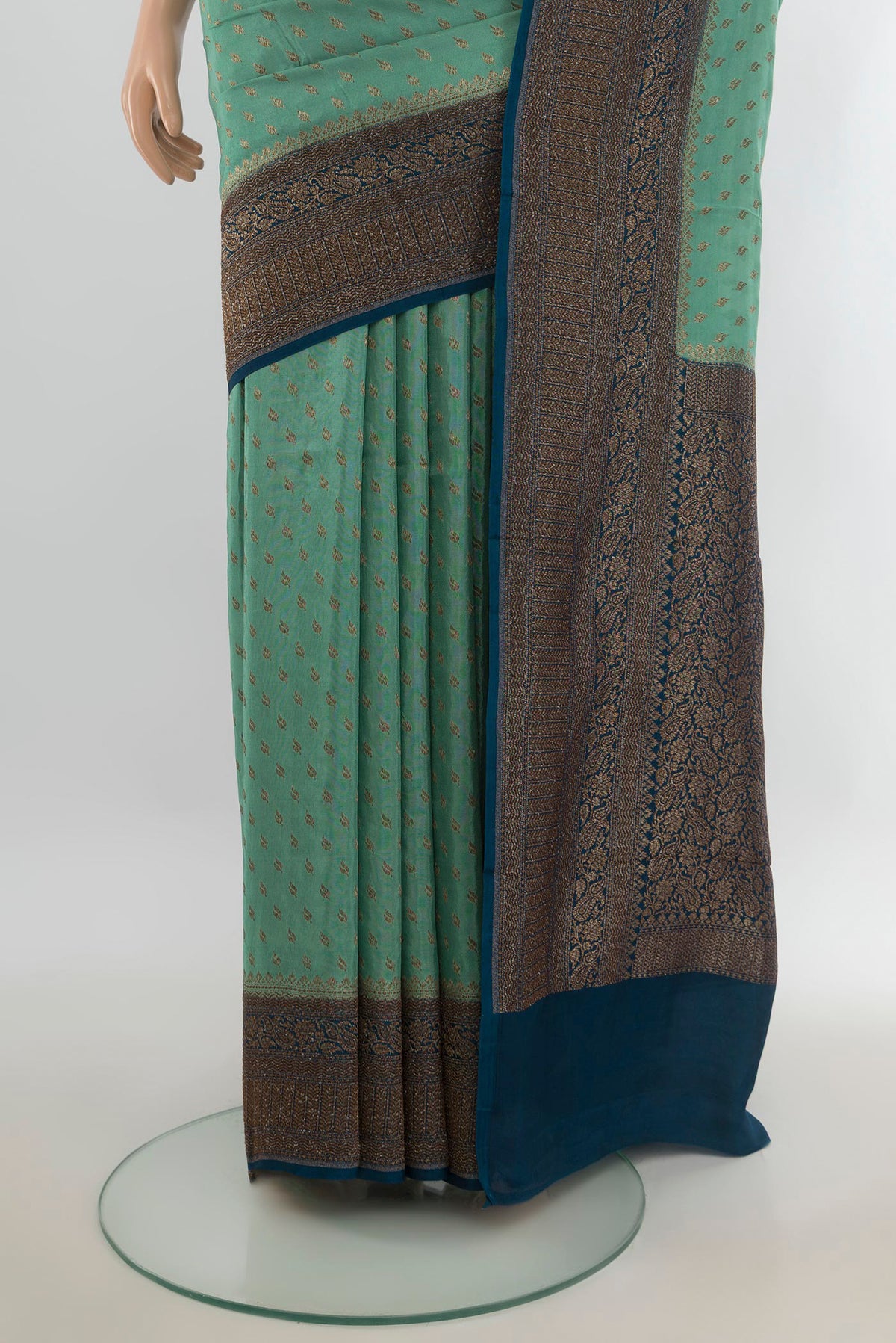 Pleats and pallu of Burgundy Art Saree with Zari Butta on the body and Silk Border. 