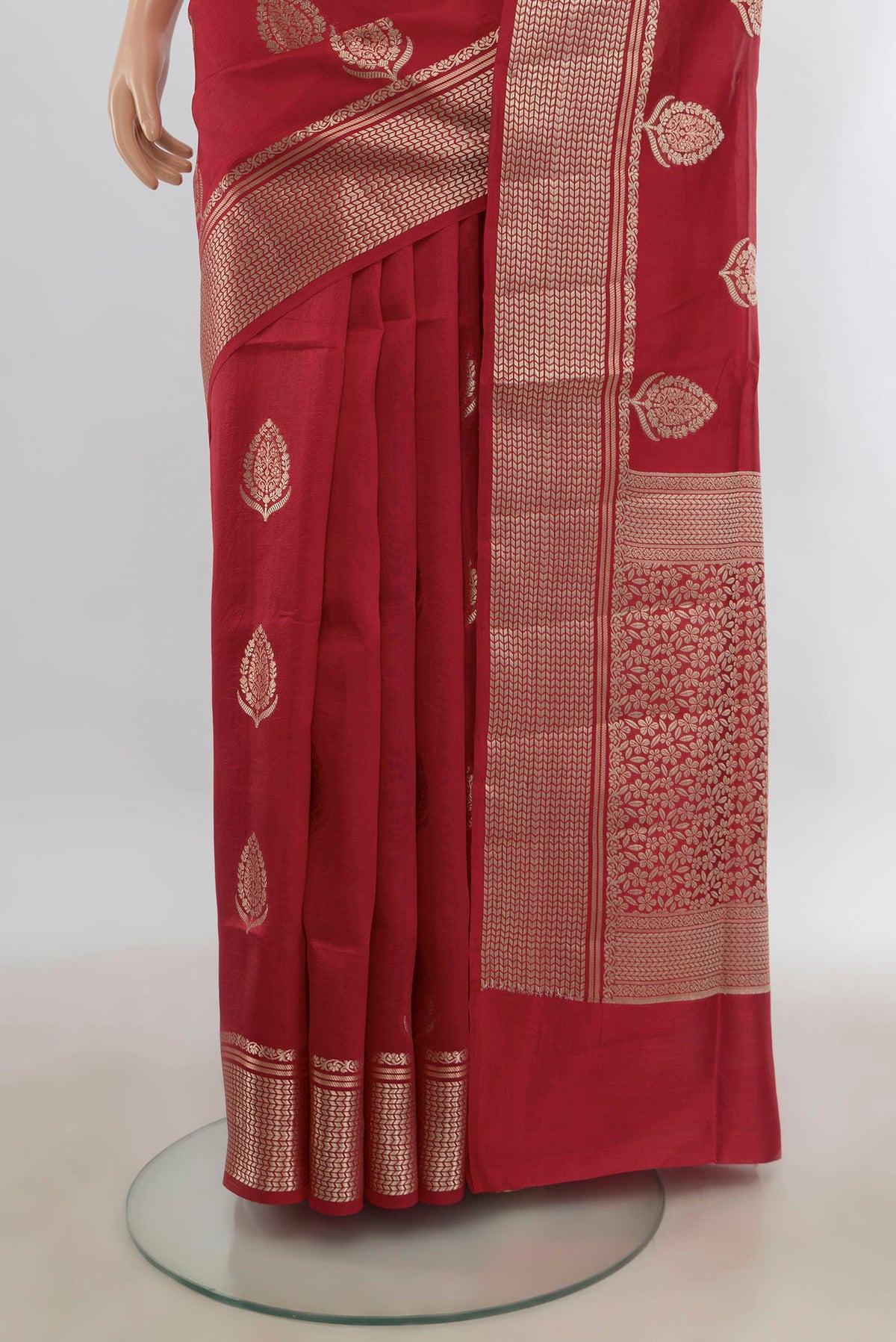 Pleats and pallu of Pure Silk Red Banarasi Raw Saree with Zari Butta on the body and Zari Border. 