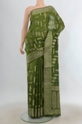 Pure Silk Green Banarasi Raw Saree with Zari Butta on the body and Zari Border.  displayed on a mannequin