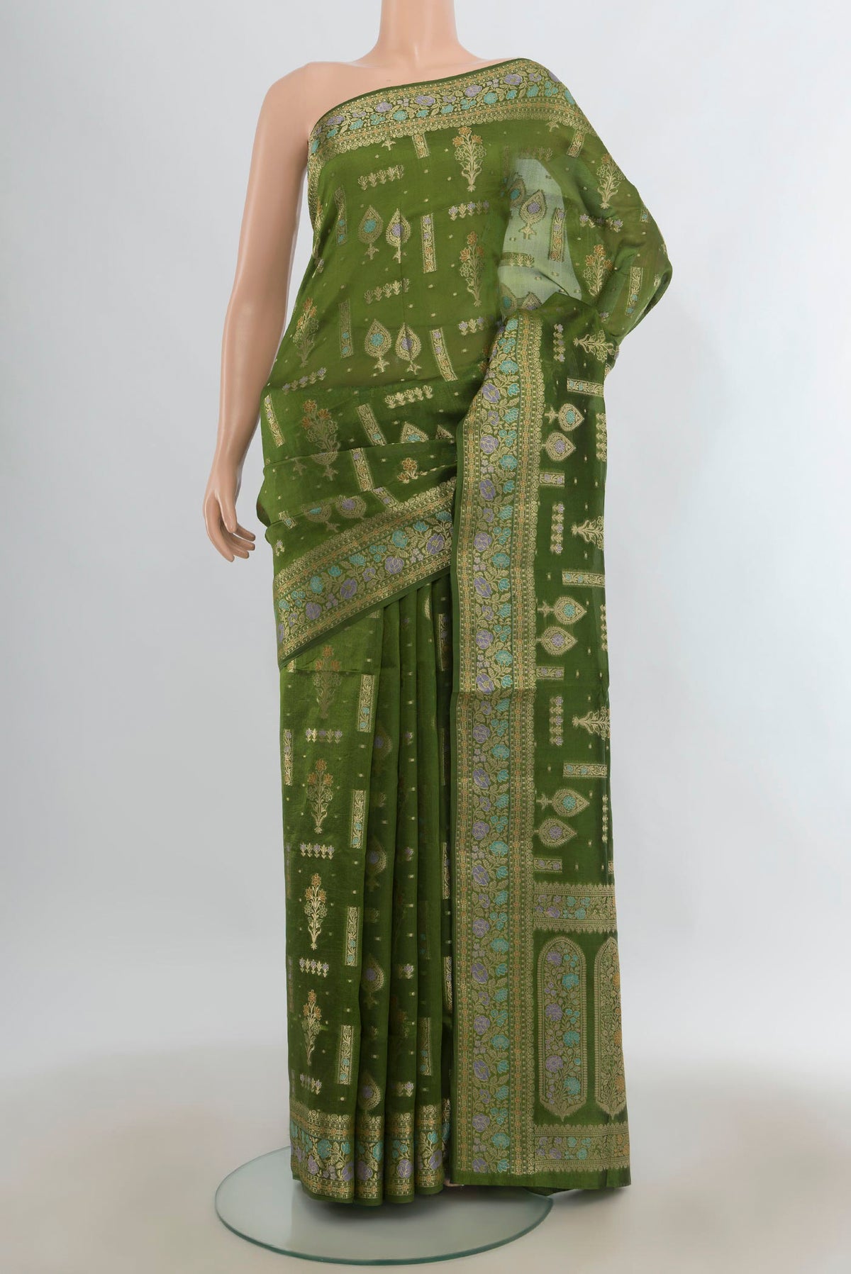 Pure Silk Green Banarasi Raw Saree with Zari Butta on the body and Zari Border.  displayed on a mannequin