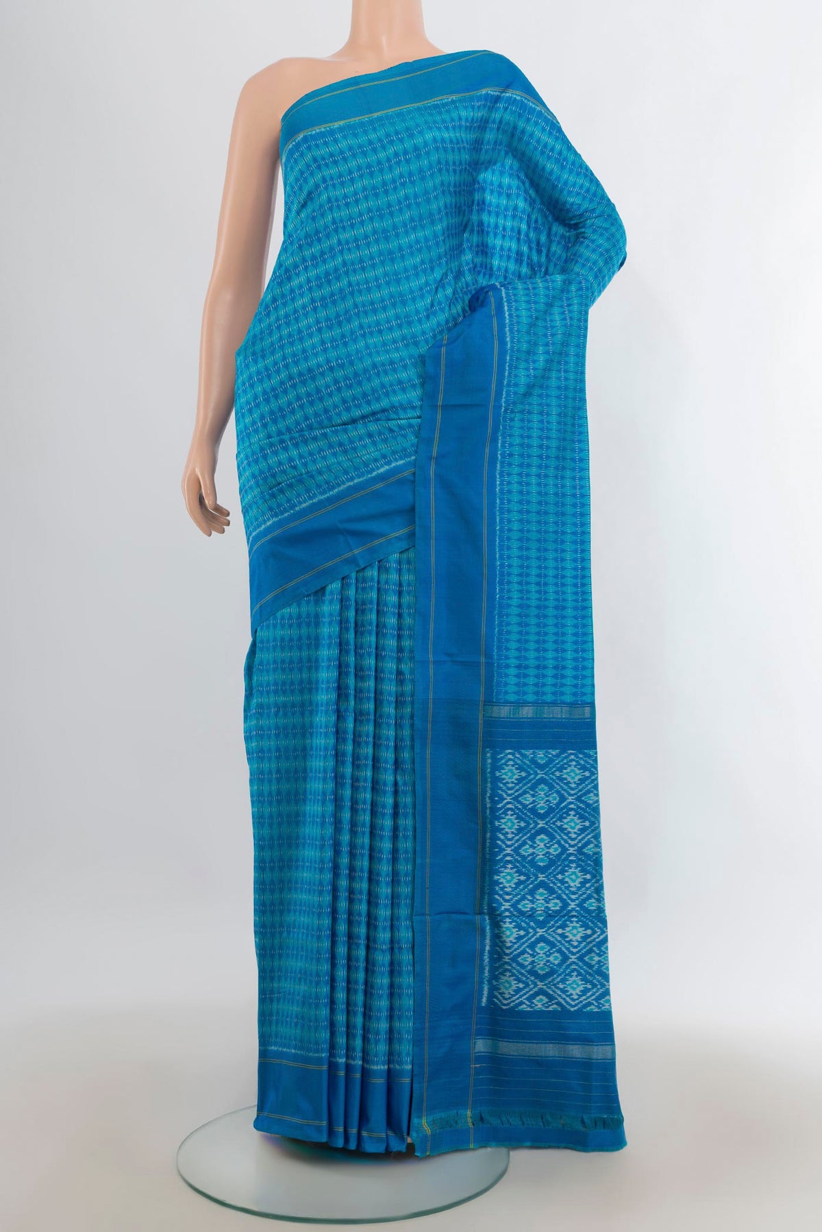 Pure Silk Blue Pochampally Saree with Pure Ikat on the body and Plain Border.  displayed on a mannequin