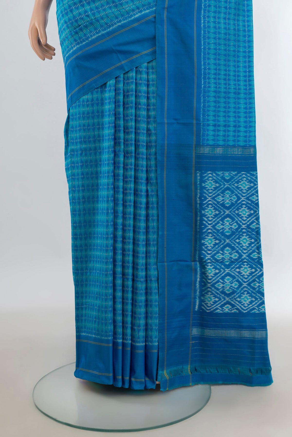 Pleats and pallu of Pure Silk Blue Pochampally Saree with Pure Ikat on the body and Plain Border. 