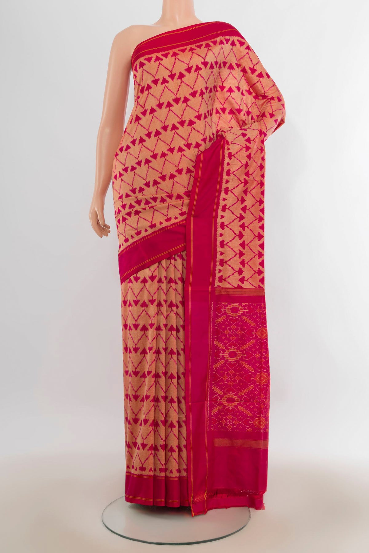 Pure Silk Peach Pochampally Saree with Pure Ikat on the body and Plain Border.  displayed on a mannequin