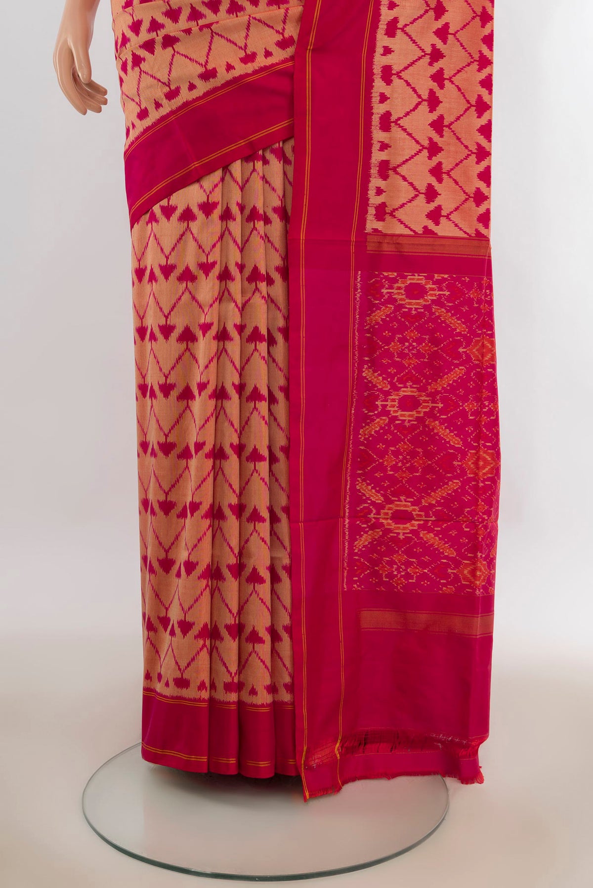 Pleats and pallu of Pure Silk Peach Pochampally Saree with Pure Ikat on the body and Plain Border. 