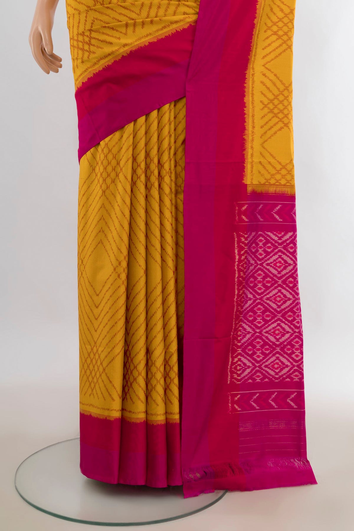 Pleats and pallu of Pure Silk Mustard Pochampally Saree with Pure Ikat on the body and Plain Border. 