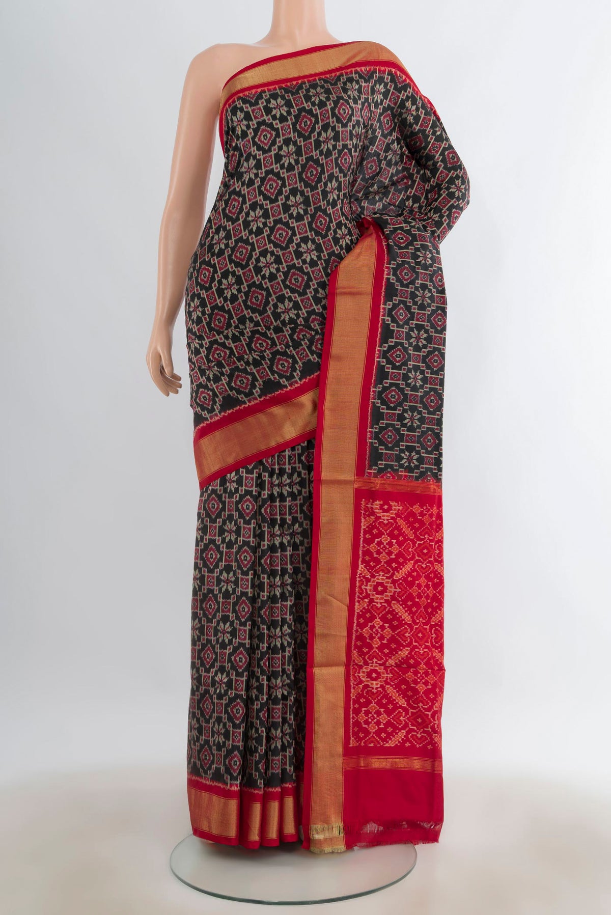 Pure Silk Black Pochampally Saree with Ikat design on the body and Zari Border.  displayed on a mannequin
