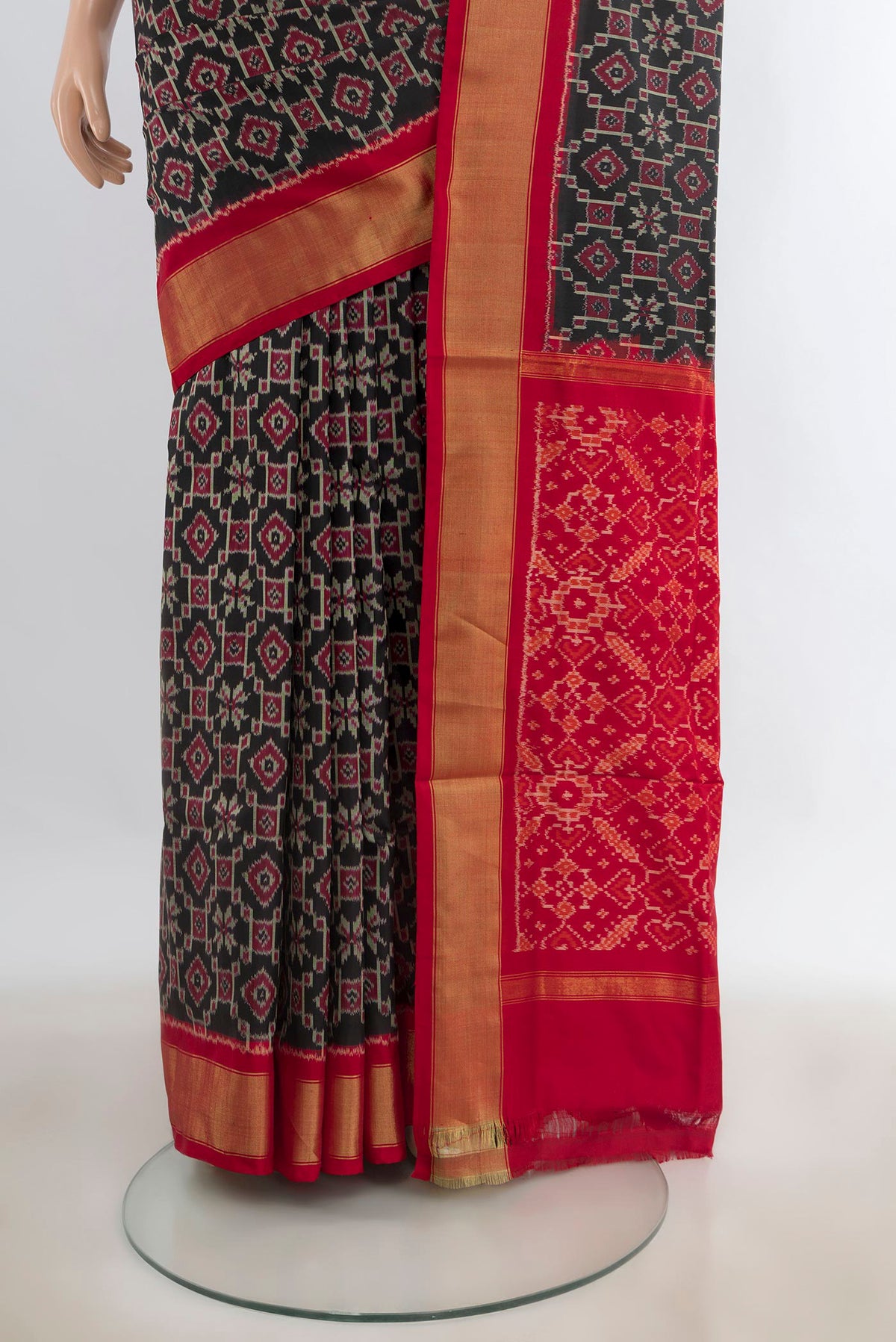 Pleats and pallu of Pure Silk Black Pochampally Saree with Ikat design on the body and Zari Border. 