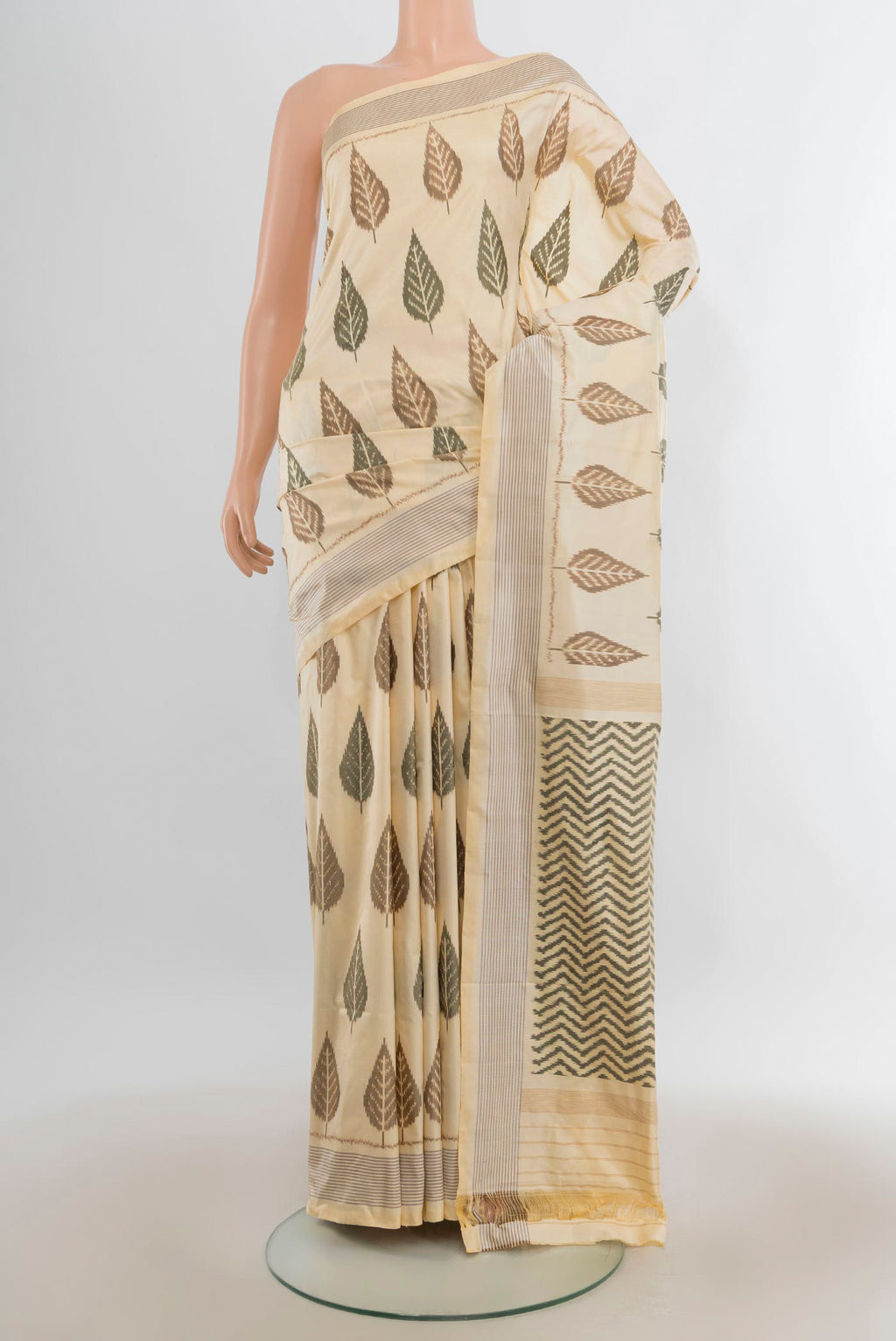 Pure Silk Cream Pochampally Saree with Pure Ikat on the body and Plain Border.  displayed on a mannequin