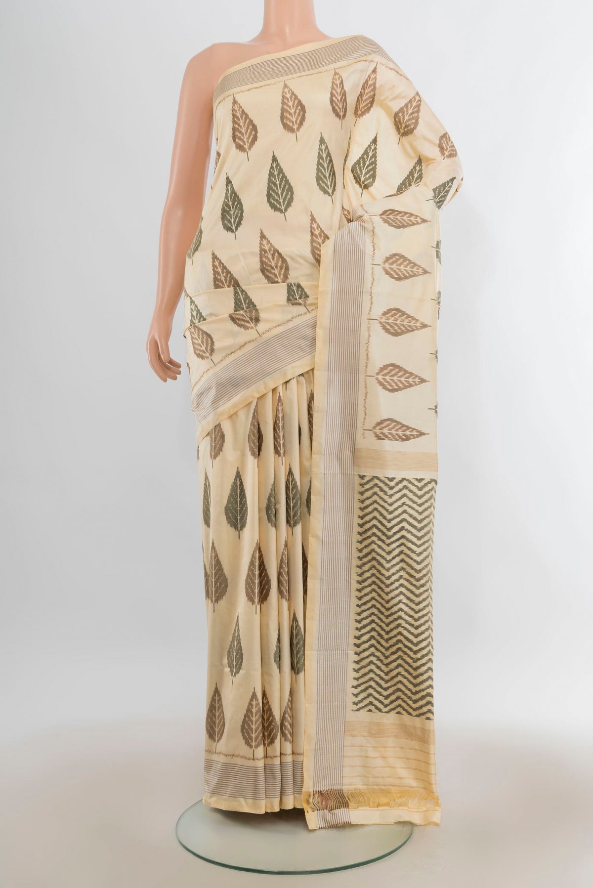 Pure Silk Cream Pochampally Saree with Pure Ikat on the body and Plain Border.  displayed on a mannequin
