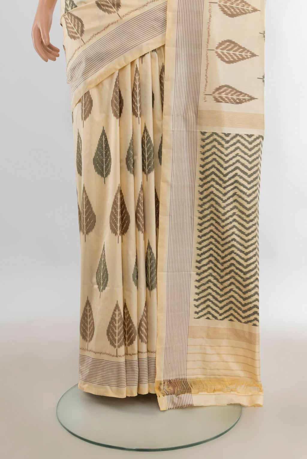 Pleats and pallu of Pure Silk Cream Pochampally Saree with Pure Ikat on the body and Plain Border. 
