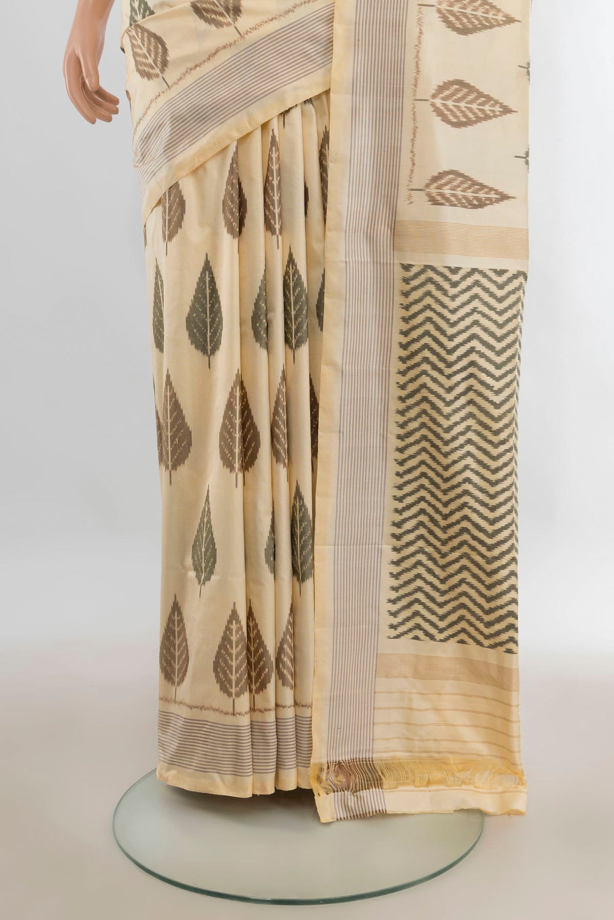Pleats and pallu of Pure Silk Cream Pochampally Saree with Pure Ikat on the body and Plain Border. 