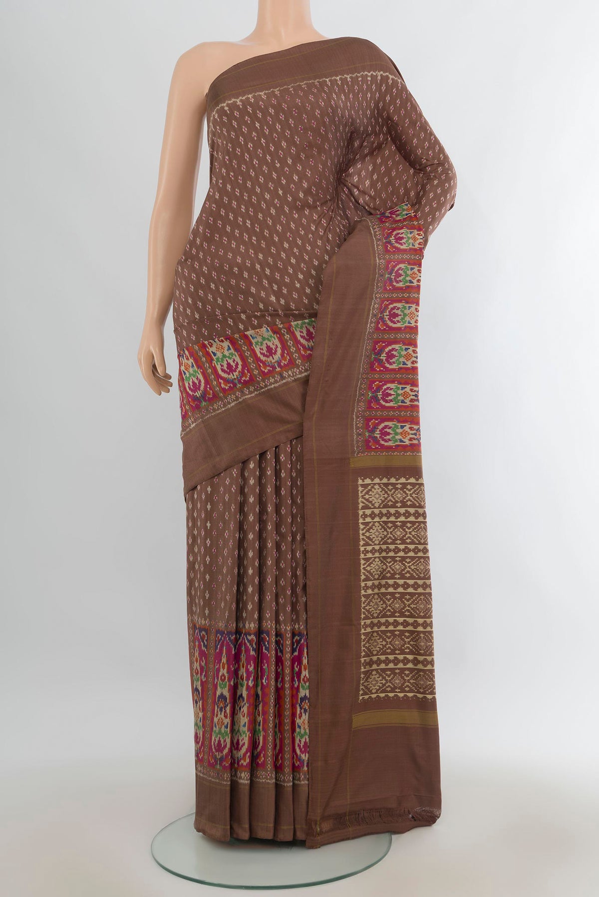 Pure Silk Coffee Brown Pochampally Saree with Pure Ikat on the body and Zari Border.  displayed on a mannequin
