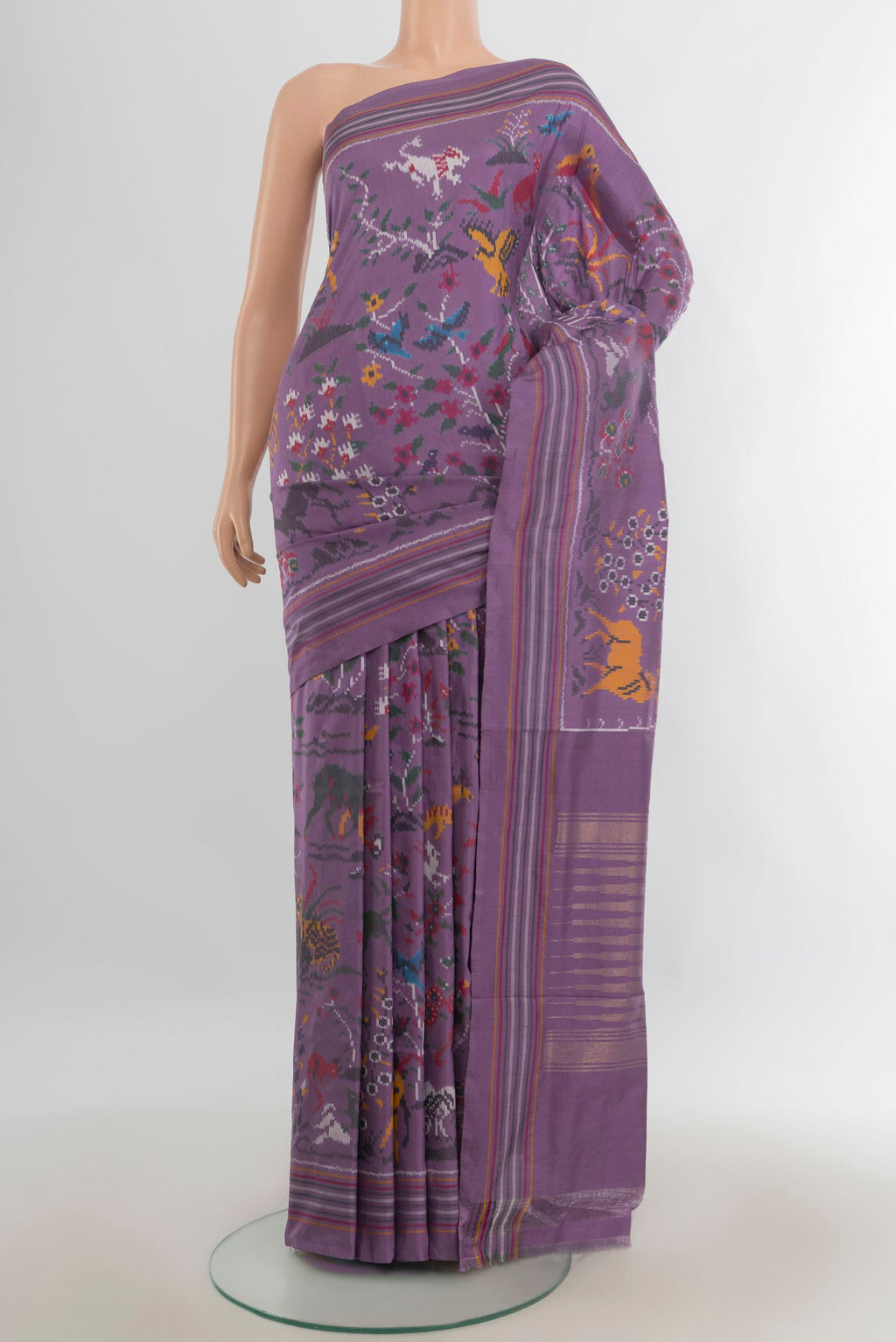Pure Silk Multi Color Rajkot Patola Saree with Ikat Print on the body and Silk Border.  displayed on a mannequin