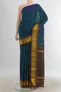 Pure Silk Peacock Blue Kanjivaram Saree with Zari Butta on the body and Silk Border.  displayed on a mannequin