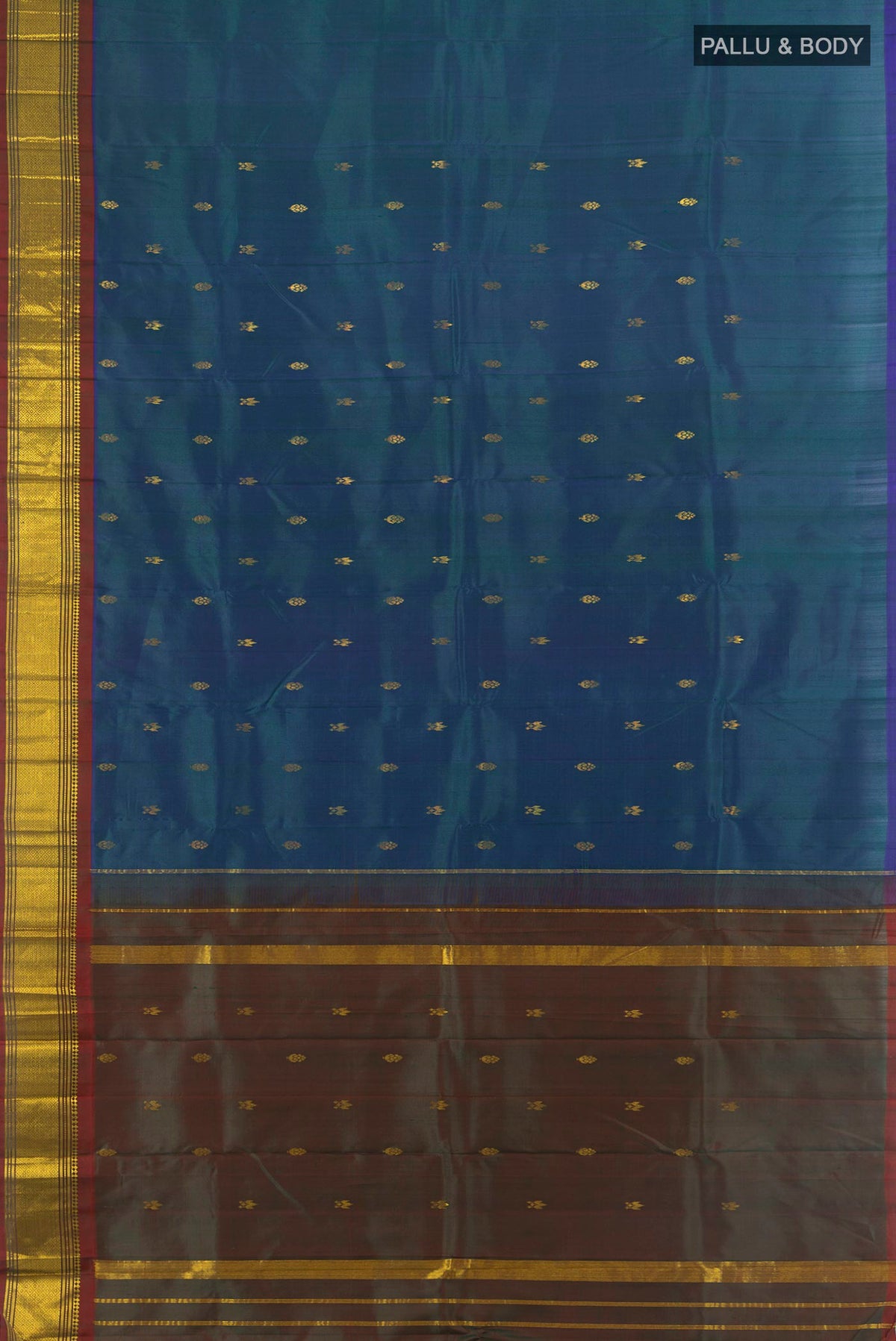 Flat view of Pure Silk Peacock Blue Kanjivaram Saree with Zari Butta on the body and Silk Border. 
