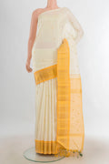 Pure Silk Cream Kanjivaram Saree with Zari Butta on the body and Silk Border.  displayed on a mannequin
