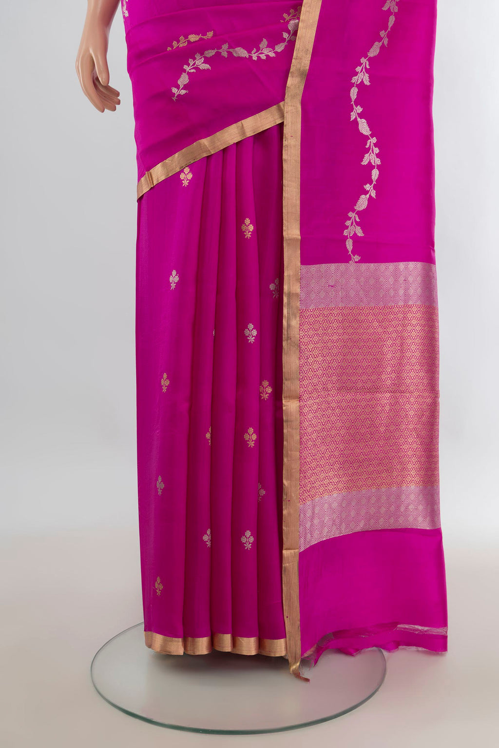 Pleats and pallu of Pure Silk Rani Pink Banarasi Katan Saree with Zari Butta on the body and Zari Border. 