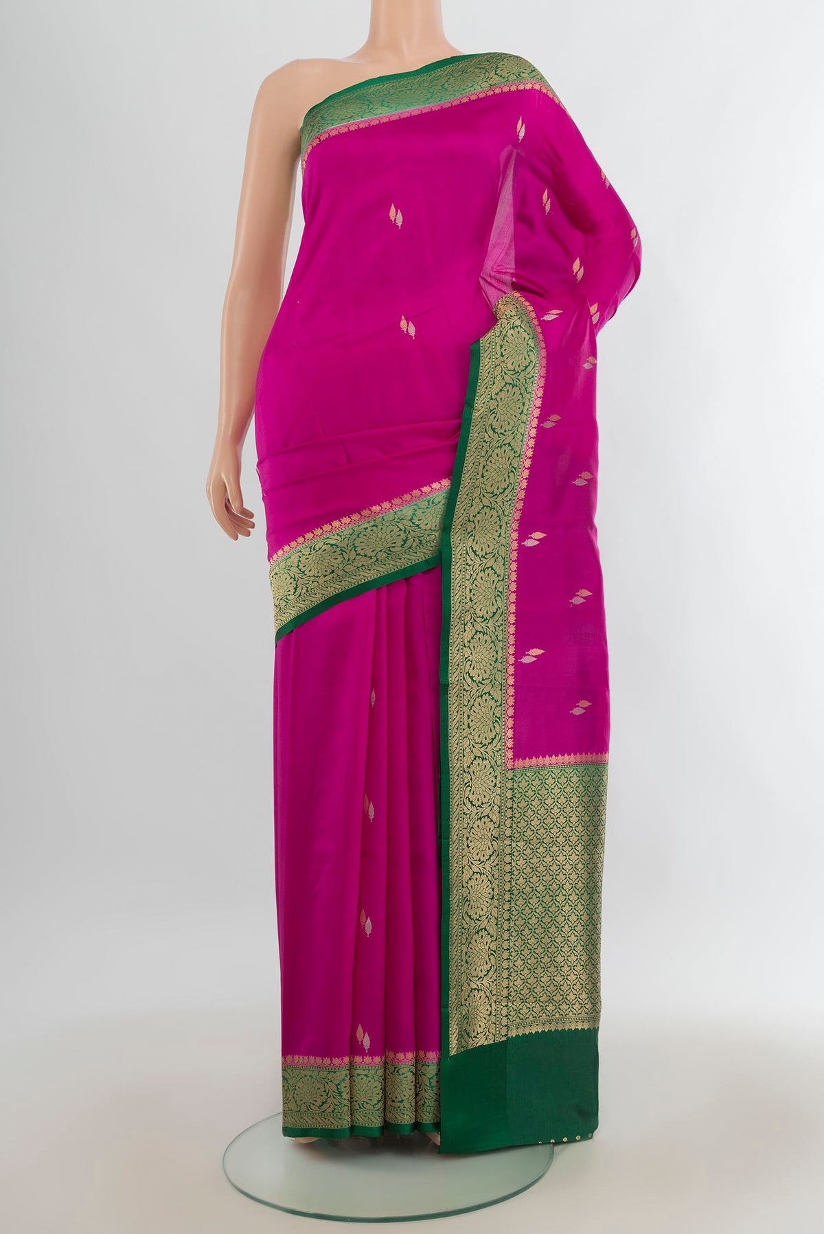 Pure Silk Pink Banarasi Katan Saree with Zari Butta on the body and Zari Border.  displayed on a mannequin