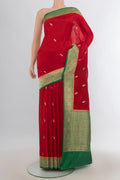 Pure Silk Red Banarasi Katan Saree with Zari Butta on the body and Silk Border.  displayed on a mannequin