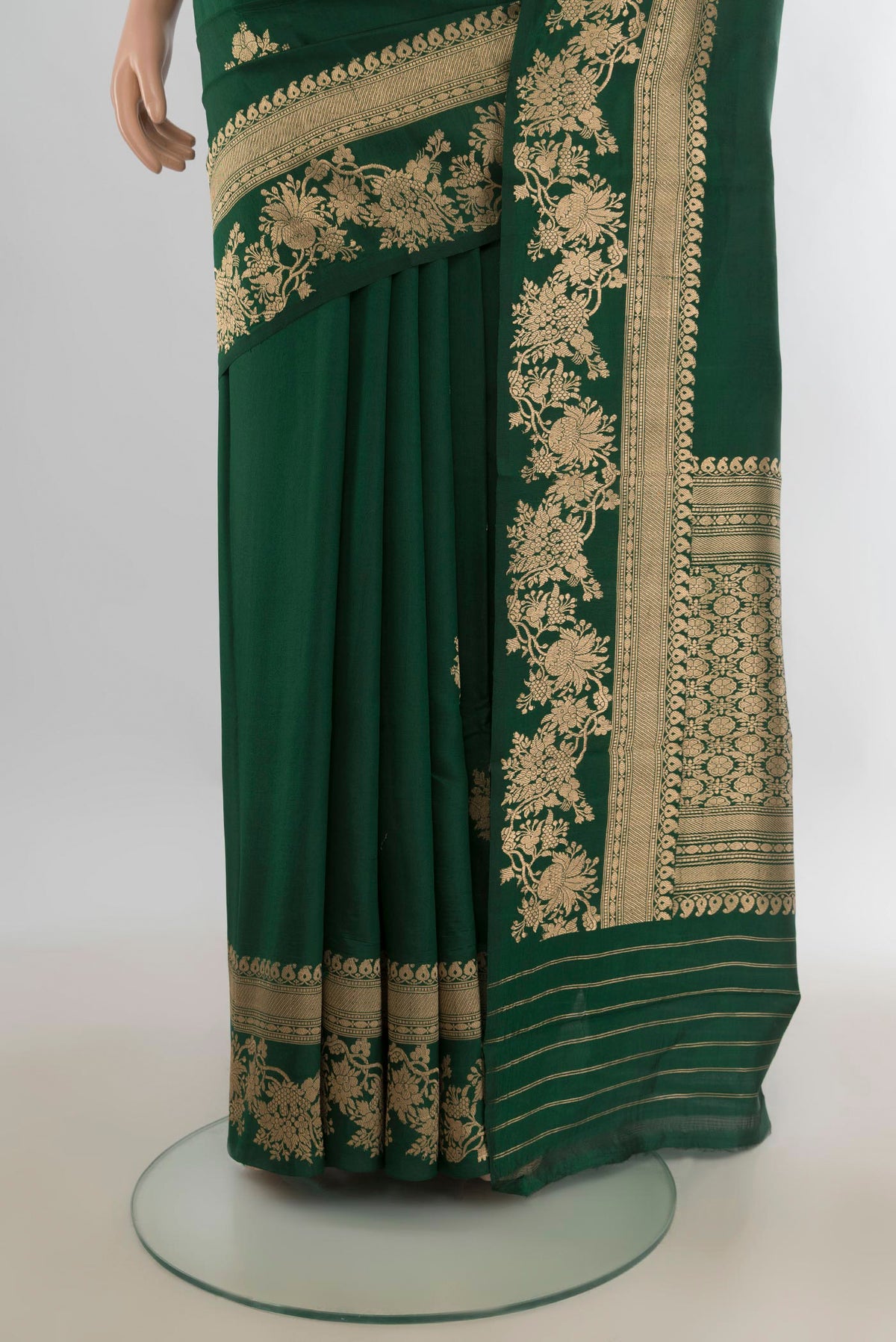 Pleats and pallu of Pure Silk Bottle Green Banarasi Katan Saree with Zari Butta on the body and Zari Border. 