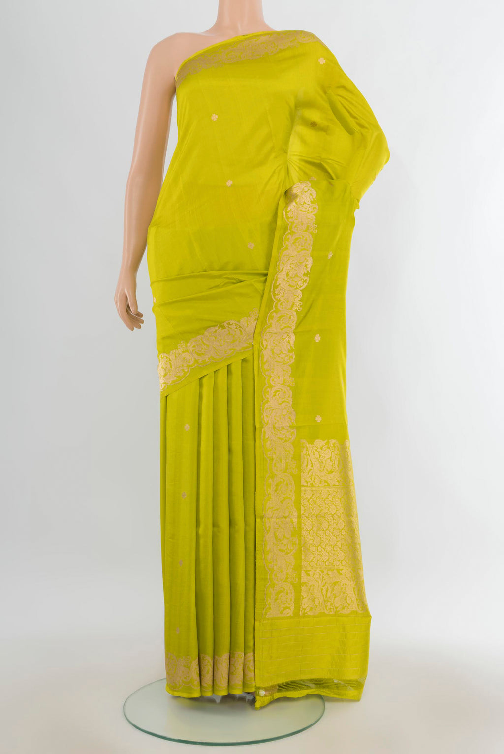 Pure Silk Parrot Green Banarasi Katan Saree with Zari Butta on the body and Zari Border.  displayed on a mannequin