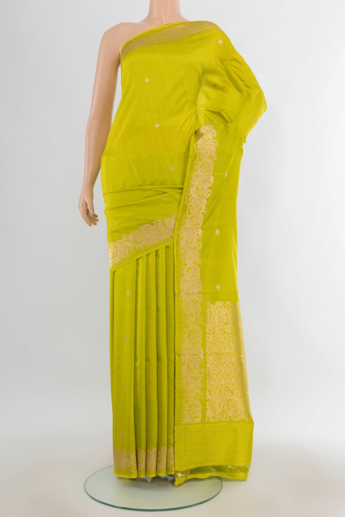 Pure Silk Parrot Green Banarasi Katan Saree with Zari Butta on the body and Zari Border.  displayed on a mannequin